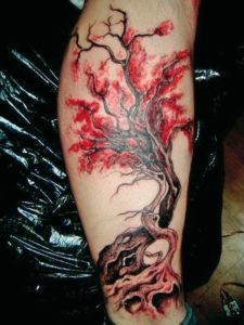 aziatsche kersenbloesem tatoeage geplaats op onderbeen