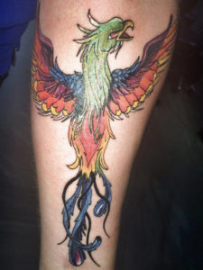 kleurrijke phoenix getatoeerd door Dutch Ink