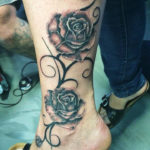 Black and grey rozen tak tattoo