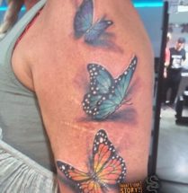 Vlinders op bovenarm