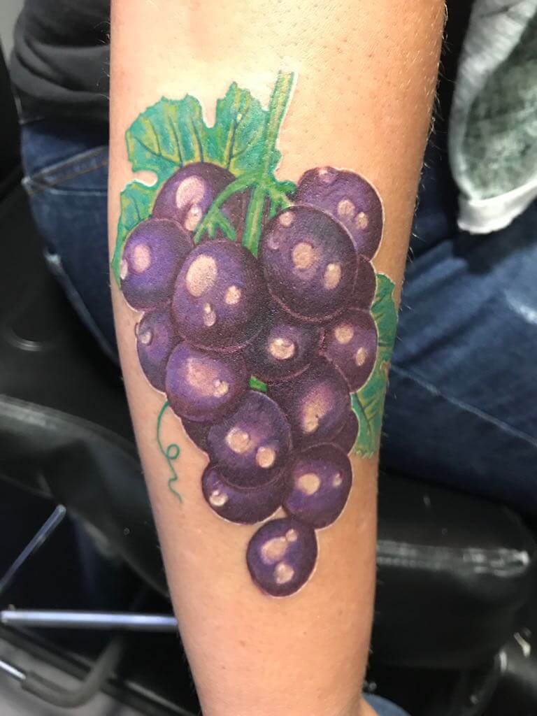 Druiven op onderarm
